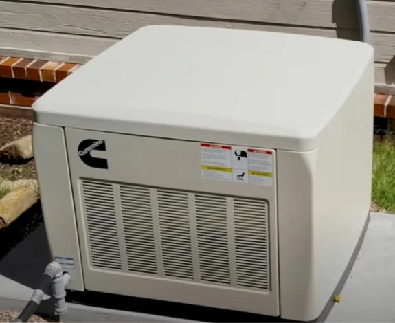Cummins home standby generator installed close to the side of a house
